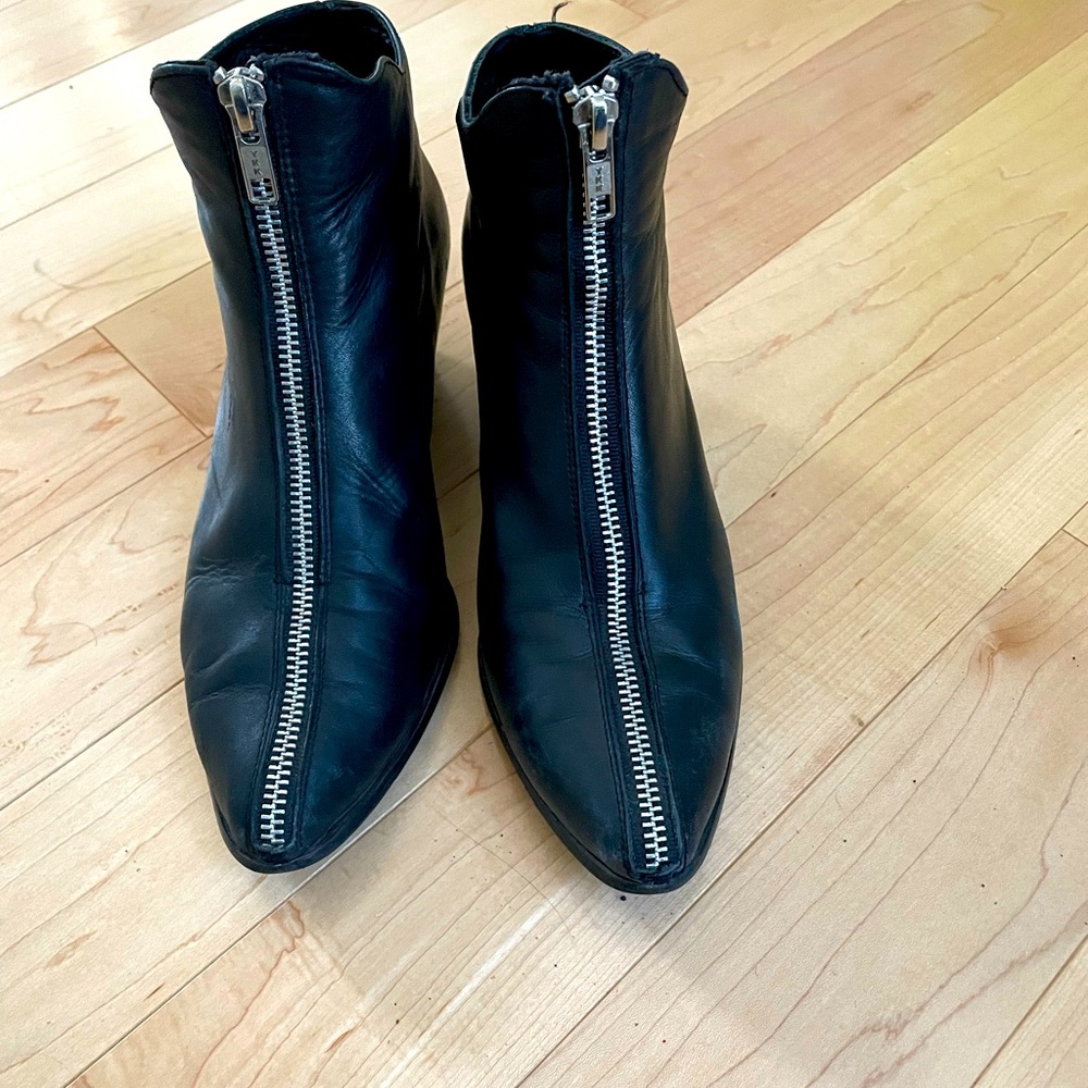 Black leather ankle boots with top zipper, size 7.